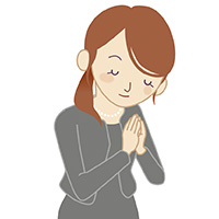 ご冥福をお祈りする女性